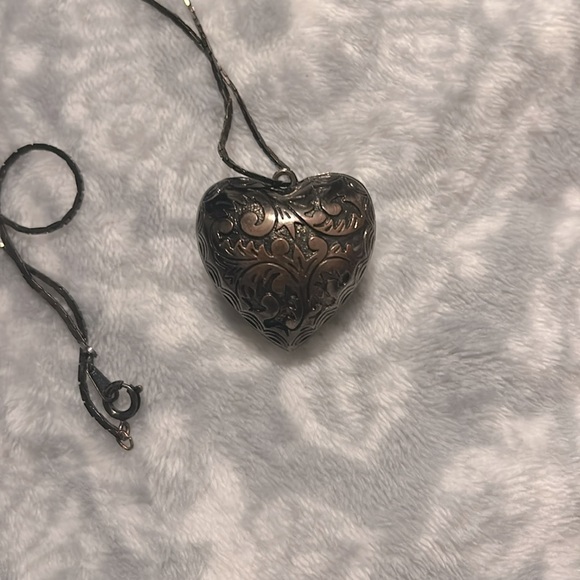 This is a bronze and black looking necklace. - Picture 3 of 5